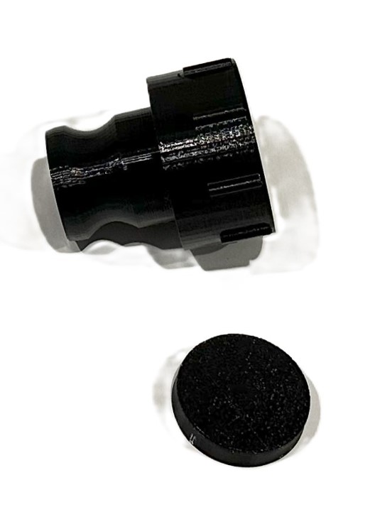 Black 3D-printed external kitchen sink adaptor and cap for a Scout 15 caravan